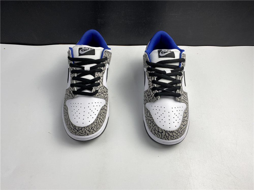from Supreme × Nike SB Dunk Low “White Cement 304292-001