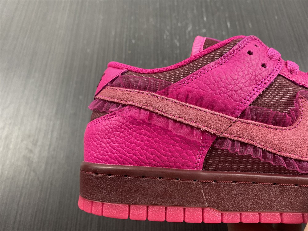 from Nike Spruces Up Its Dunk Low Team Red/Pink DQ9324-600